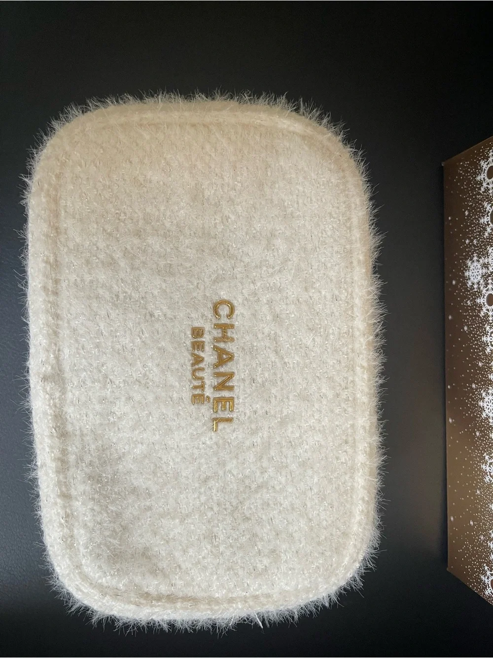 CHANEL Cream Faux-Fur Cosmetic Pouch with Gold Logo. Limited edition